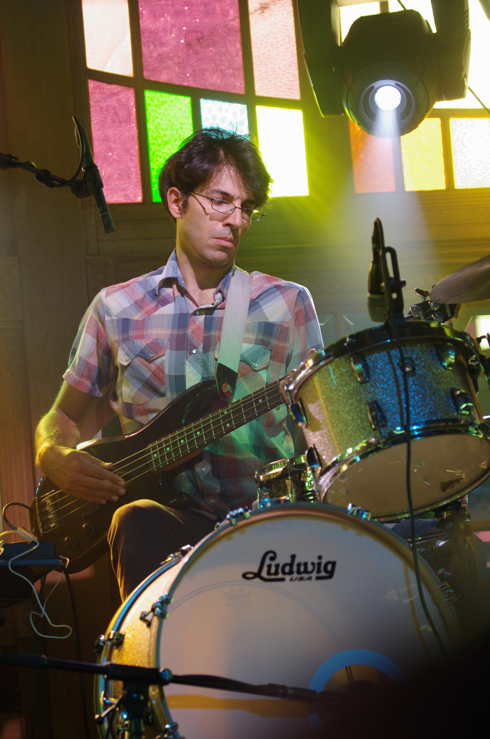 Chris Vatalaro, the new drummer, infusing the set with fresh rhythmic energy during a live performance.